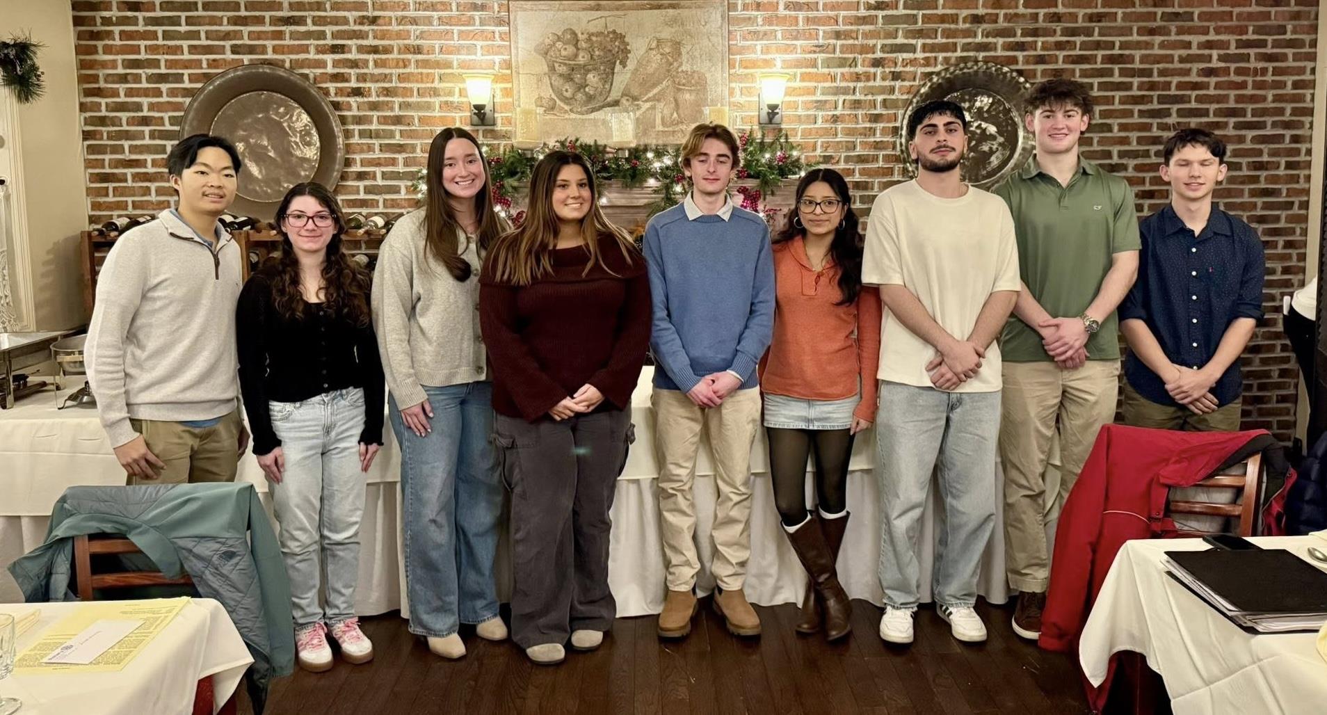 Nine people standing in a row