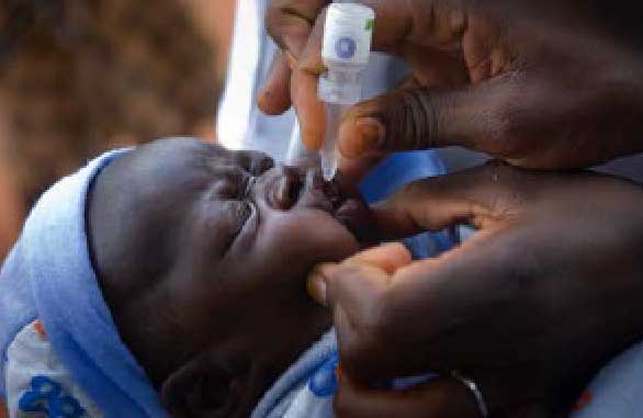 Infant receiving polio immunisation drops
