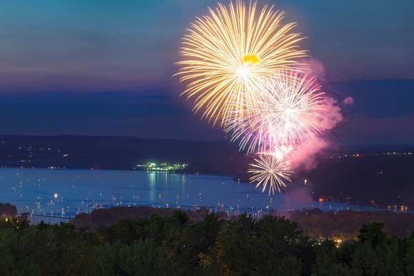Image of fireworks bursting over Cayuga Lake