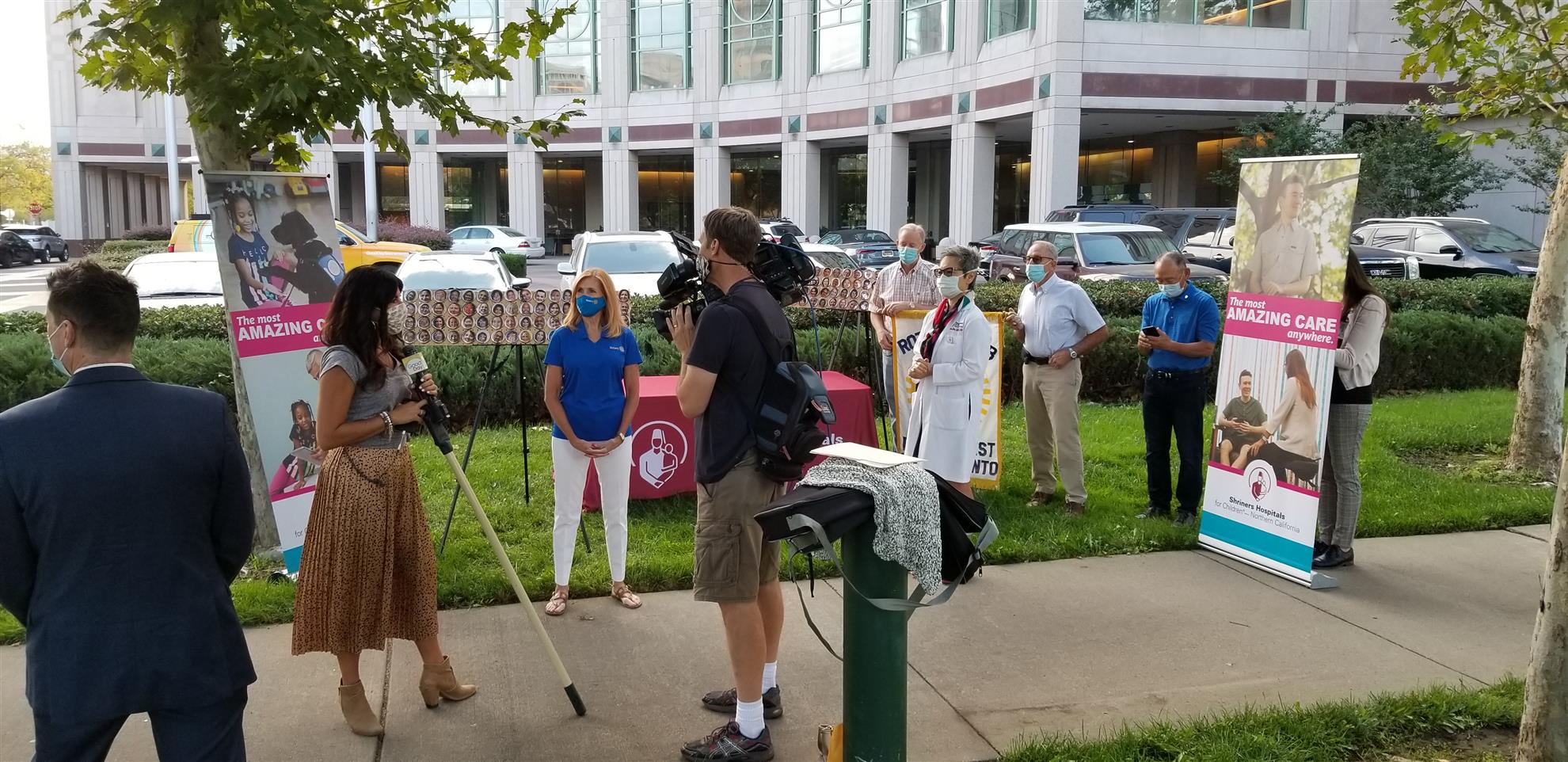 Point West Rotary presents nurse's buttons to Shriner's Childrens