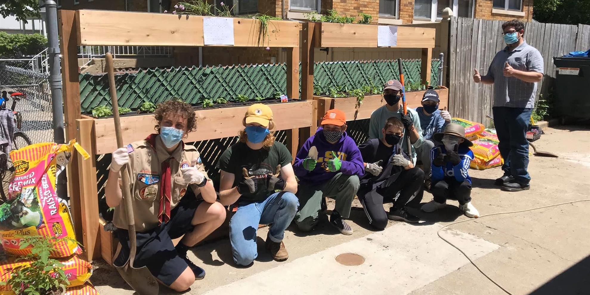 Eagle Scout beneficiaries building a Raised Garden