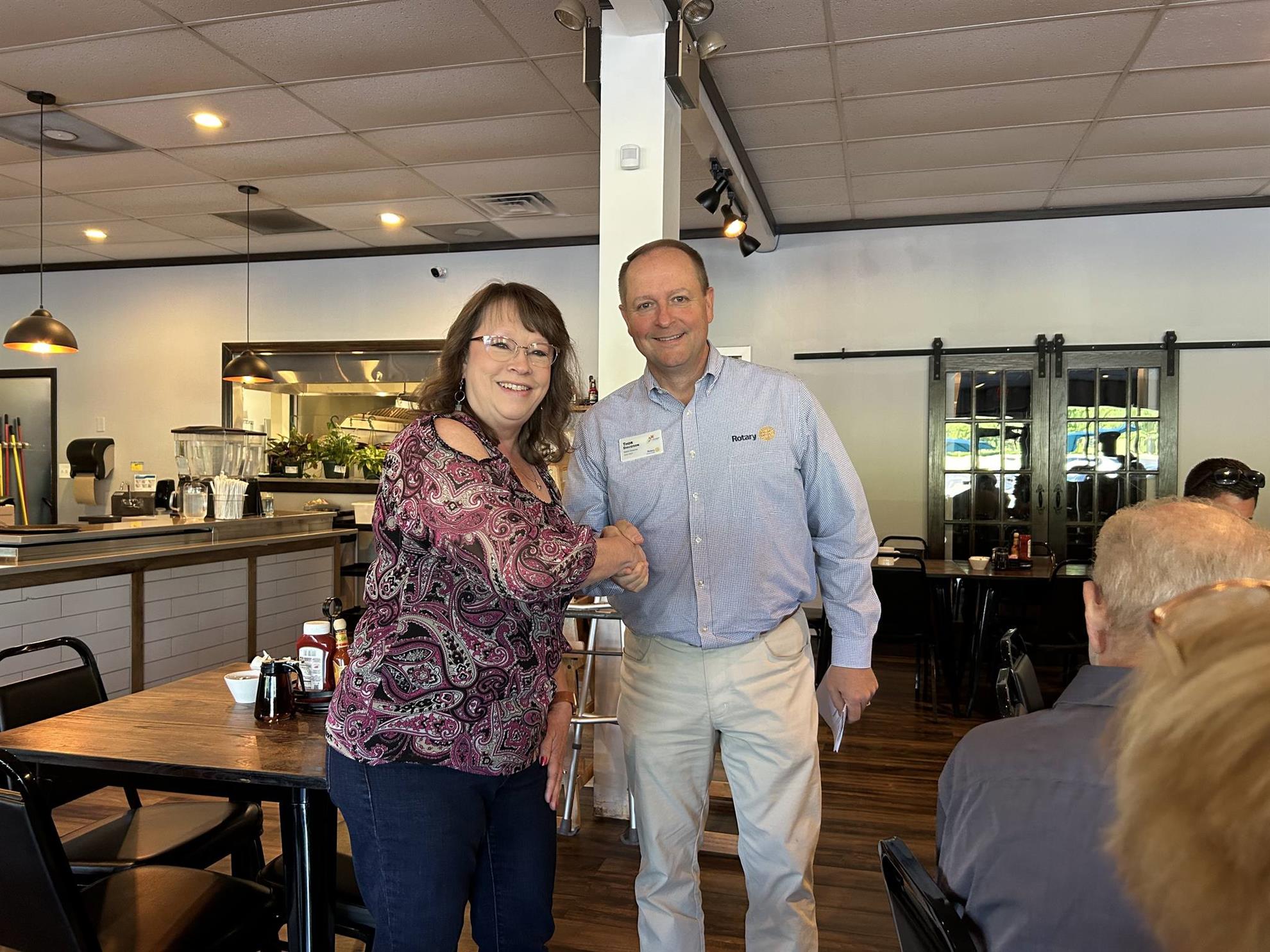 Mary Witte-Tabbert Congratulated by District Governor Thor Davidson