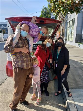 Service above self can begin at any age. Molly and Katie joined their dad, Eric Schmautz, District Governor Danielle Lallement, and President Mary Liu to deliver meals to The Arc participants.