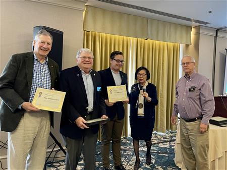 Inducted into Paul Harris Society were Peter Logan, David Dye, and President Christopher by Carrie Chinn and Jim Patrick