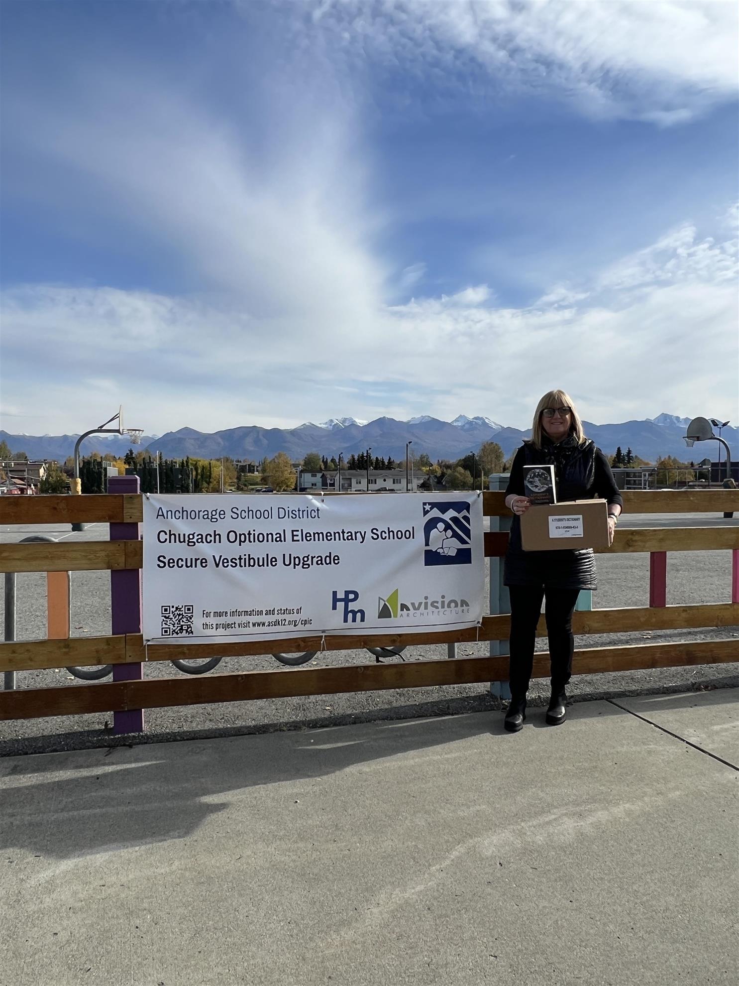 President Denise stops by Chugach Optional to deliver dictionaries
