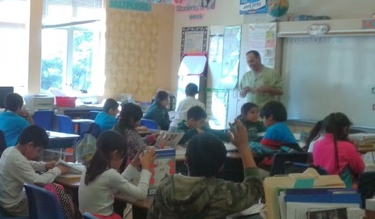 Aref conducting quizzes from the January 2015, "Dictionary" project delivery at Bahia Vista Elementary