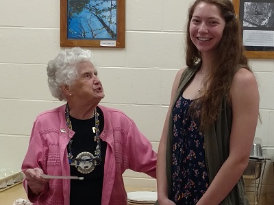 Elena Tansley receives her award from club president Rita Hinds on July 28