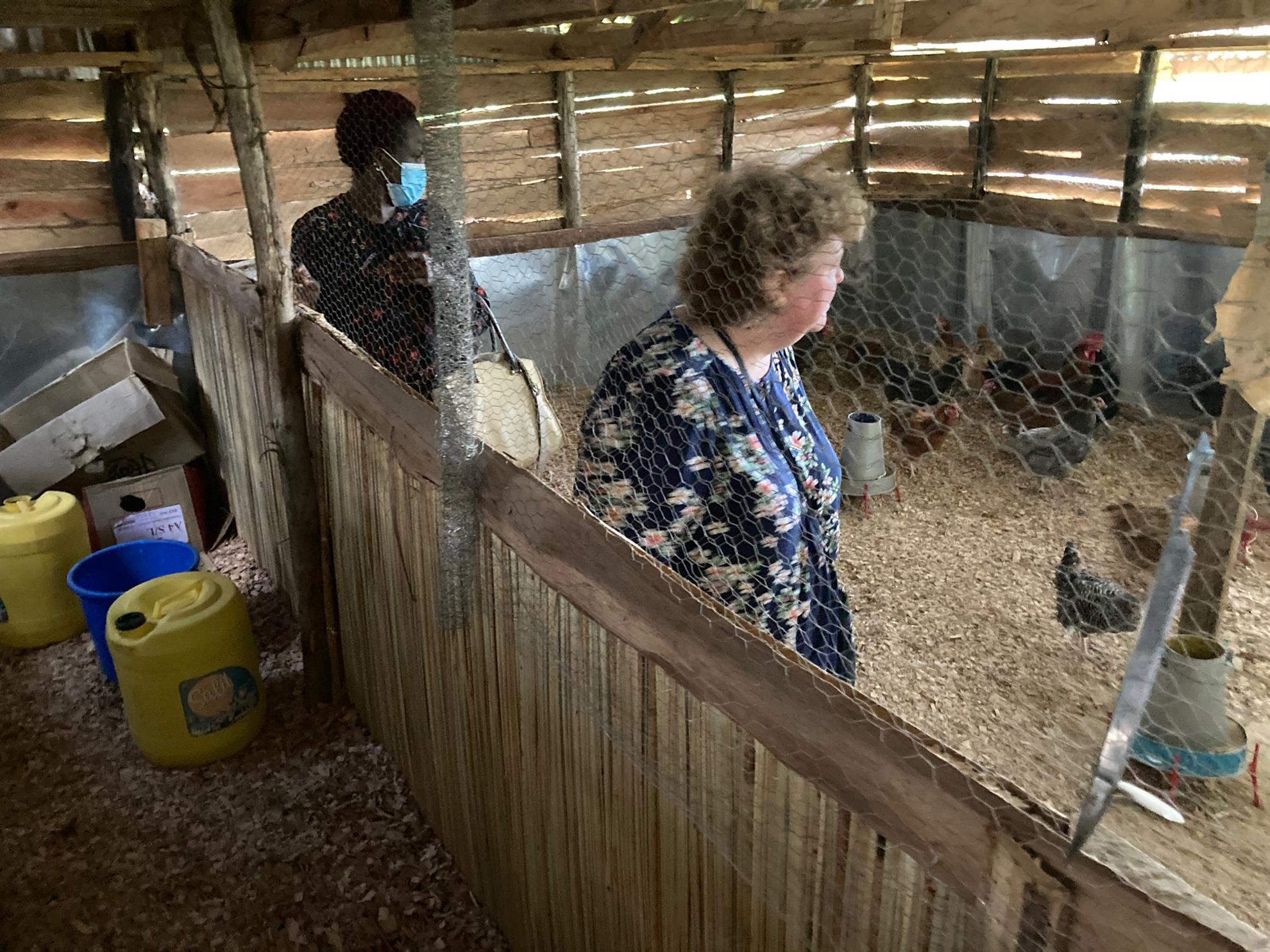 Rotary partner Wanda Salter inspects the chicken coop built with Rotary Club of Bellows Falls funds