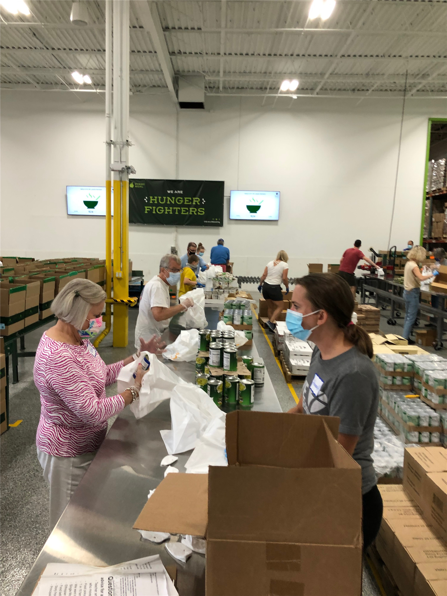 COL Rotarians help pack food for kids at Every Meal