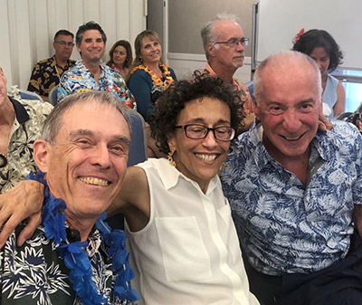 Rotary members in Hawaiian shirts smiling