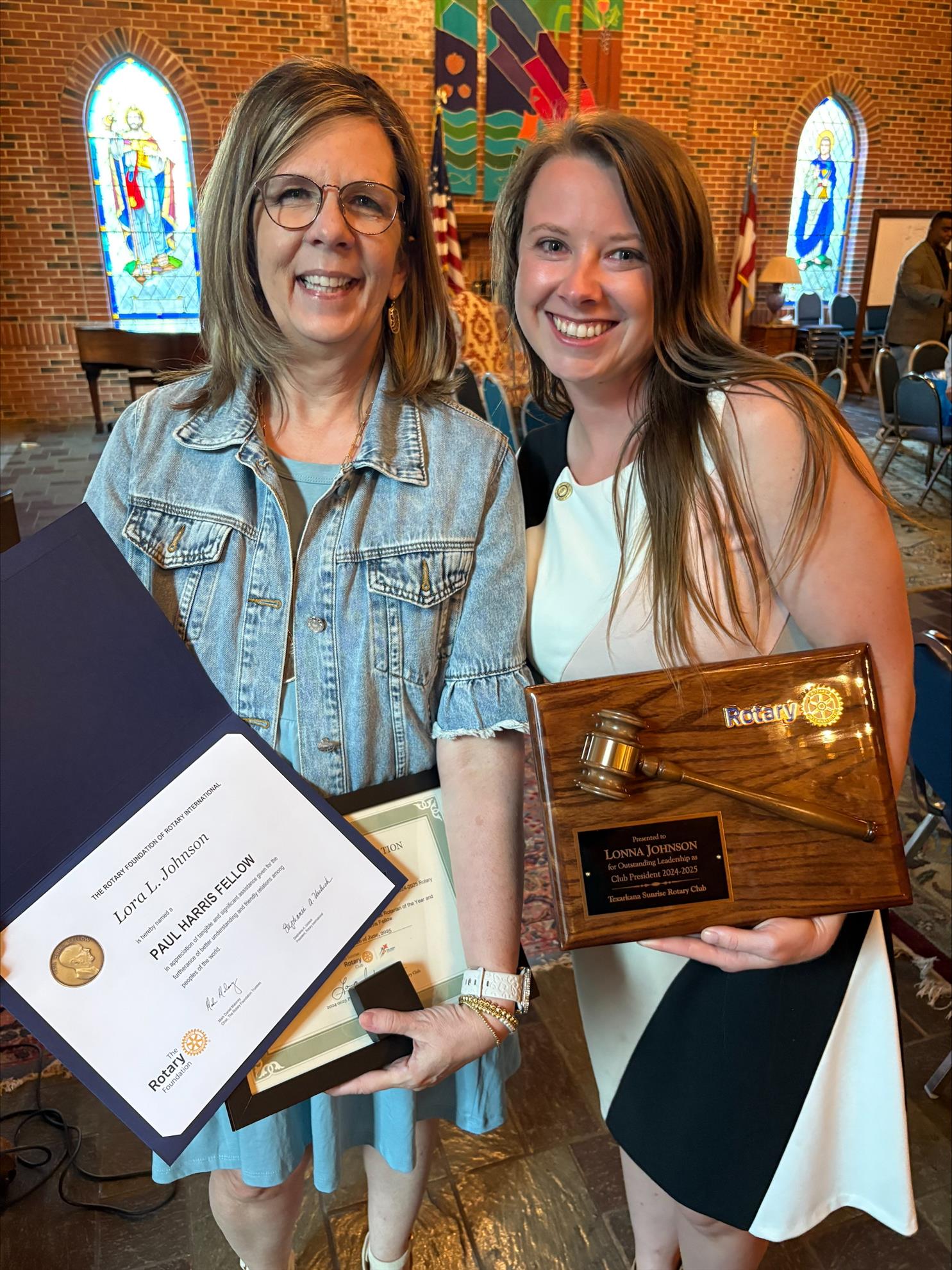 Lora Johnson received Rotarian of the Year Award from President Lonna Johnson