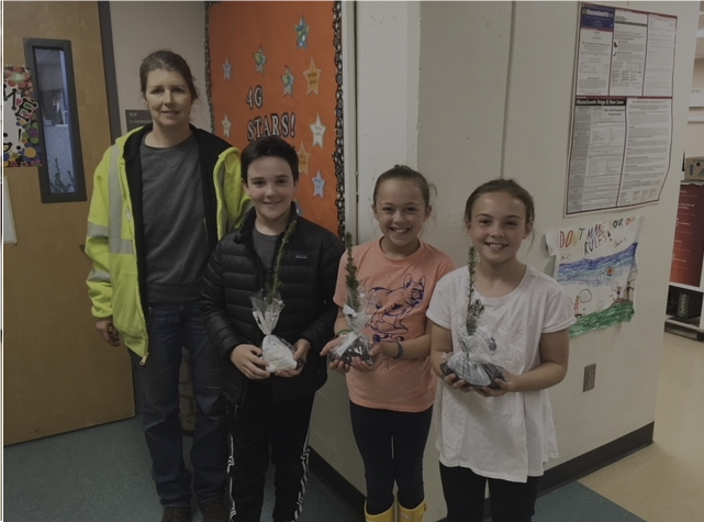 Wellesley fourth graders receiving Arbor Day saplings