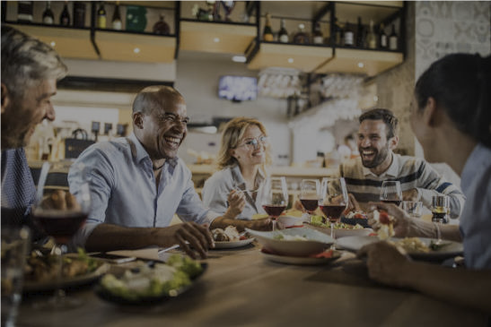 Friends enjoying dinner together at a local restaurant