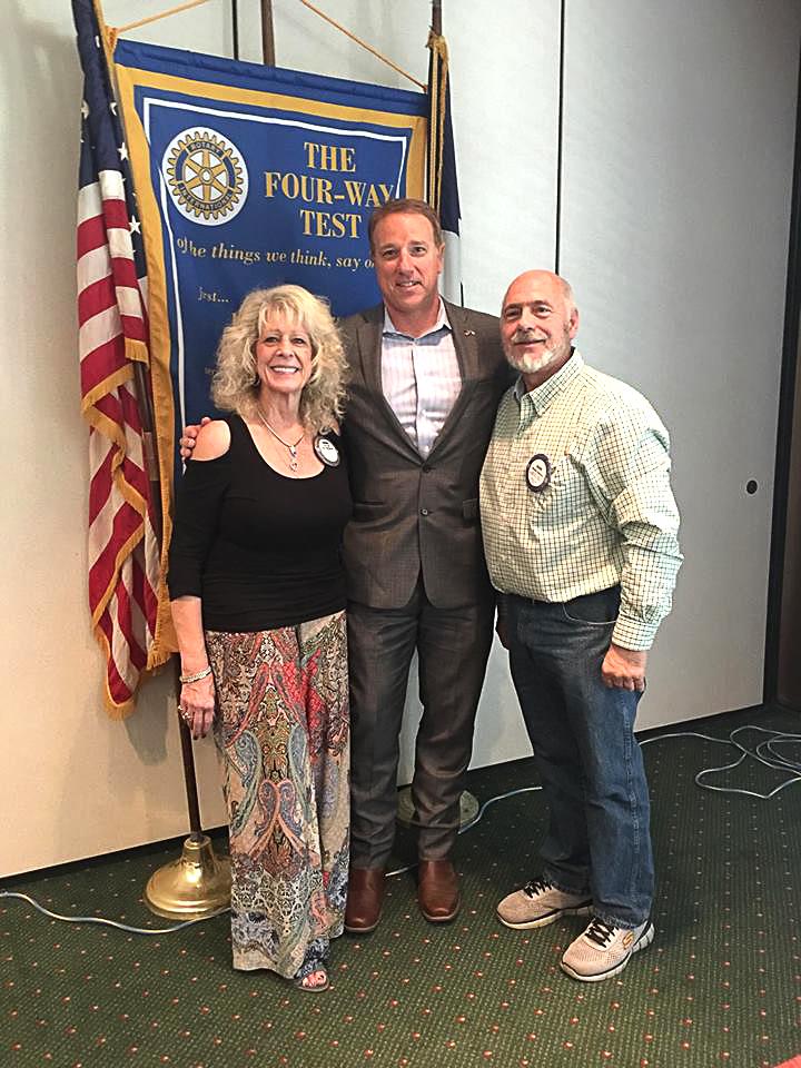 Patrick Fallon is pictured with program chair Connie Ball, left, and Rotary Club of Mineral Wells president David Cairone.