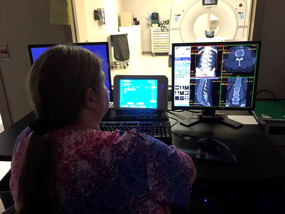 Sharon Neal of PPGH's Radiology Department read s a CT scan.