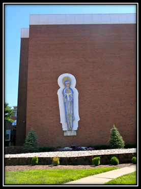 In 1974, the mosaic Madonna, made in Italy, was attached to an outer wall located in the front of Saint Clare's Hospital.