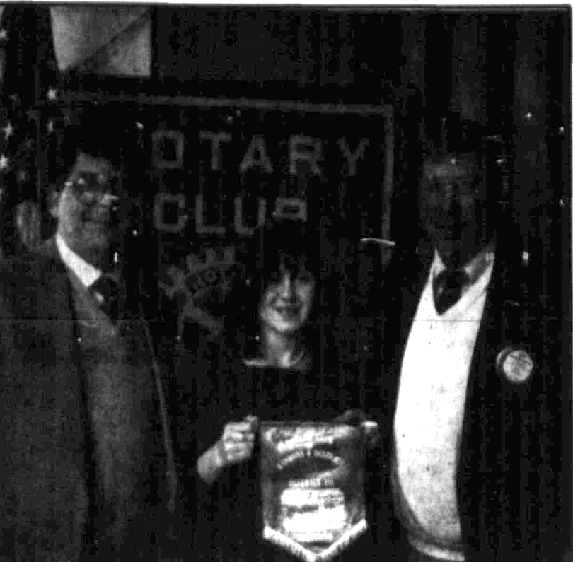Patricia Cignarella presents a Scottish Rotary banner to Joseph McCaffrey and Joseph Zahn, 1993