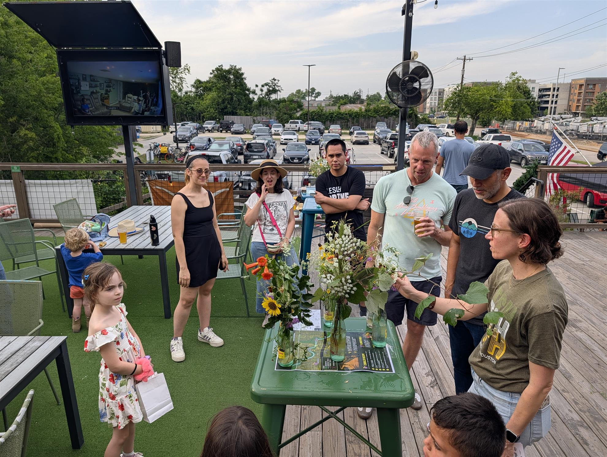 A small group of people looking at wildflowers to judge the competition.