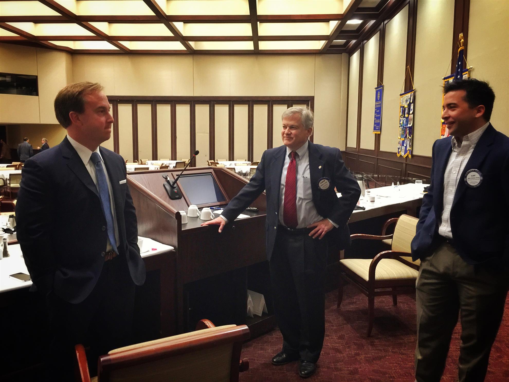 Derek Waltchack speaks with Clinton Smith and Clint Kirby after the meeting.