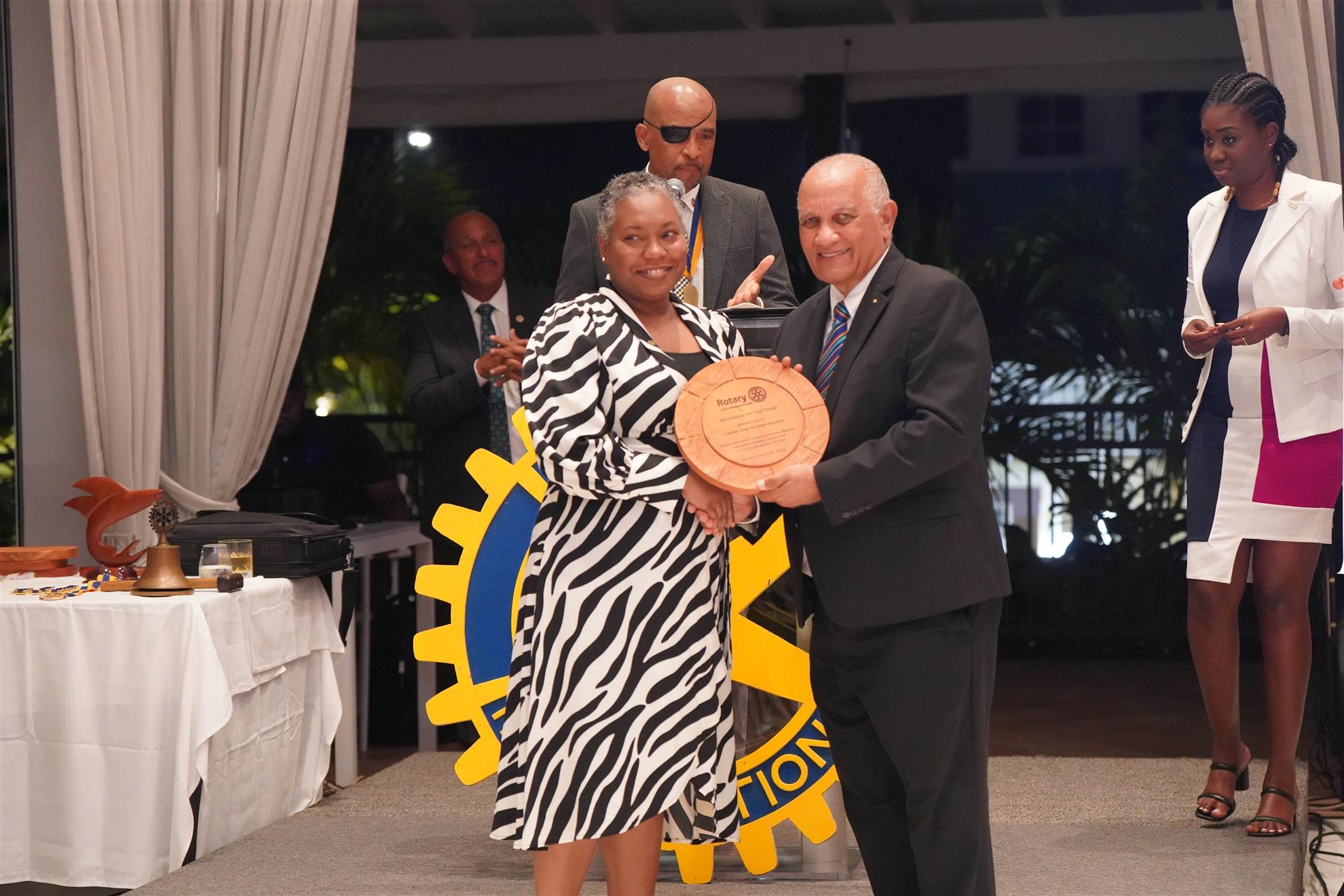 Director Carrie-Ann receiving her award for Rotarian of the year from PDG David