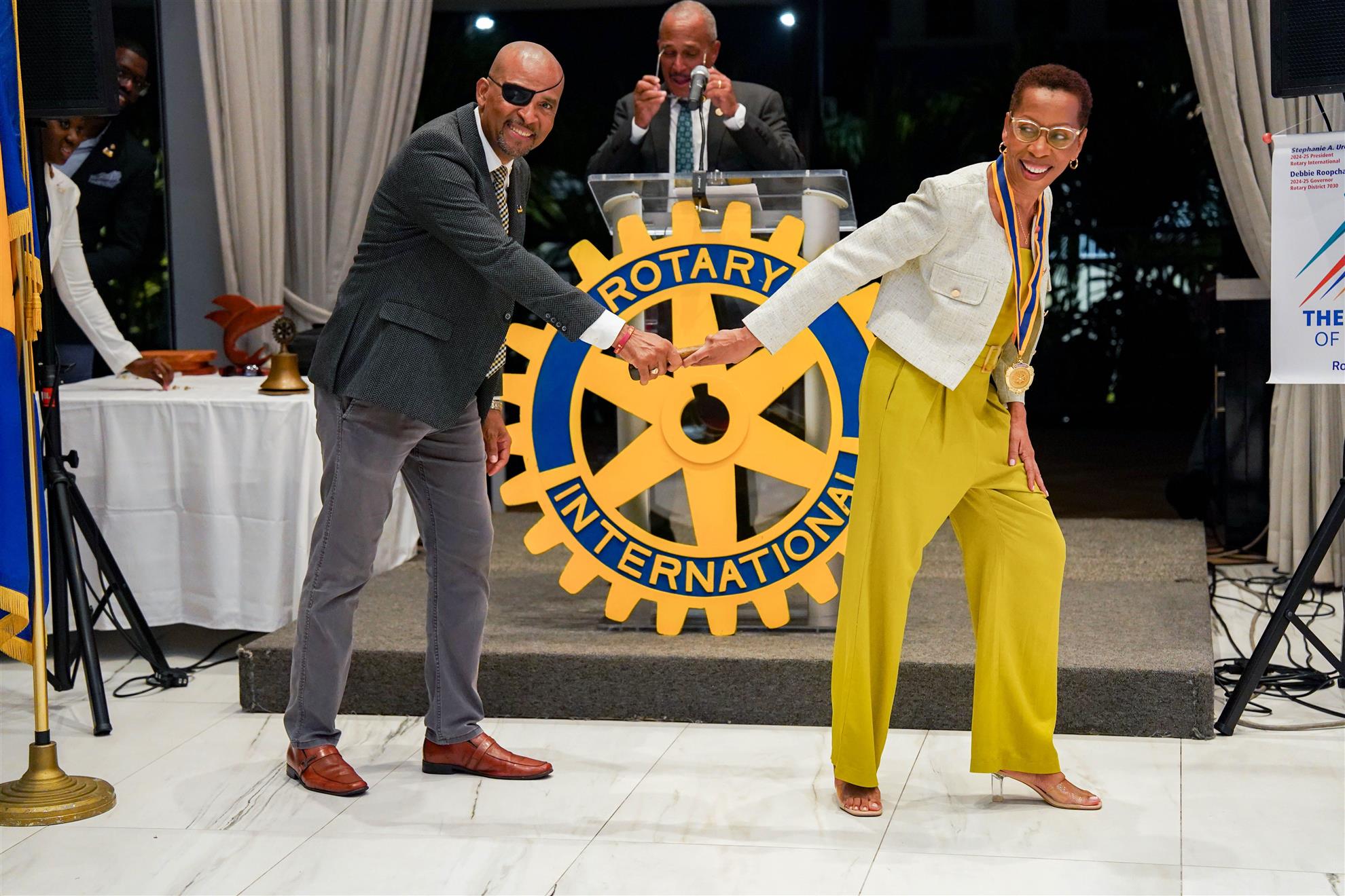 Image of baton hand over between IPP Marcel and President Terry