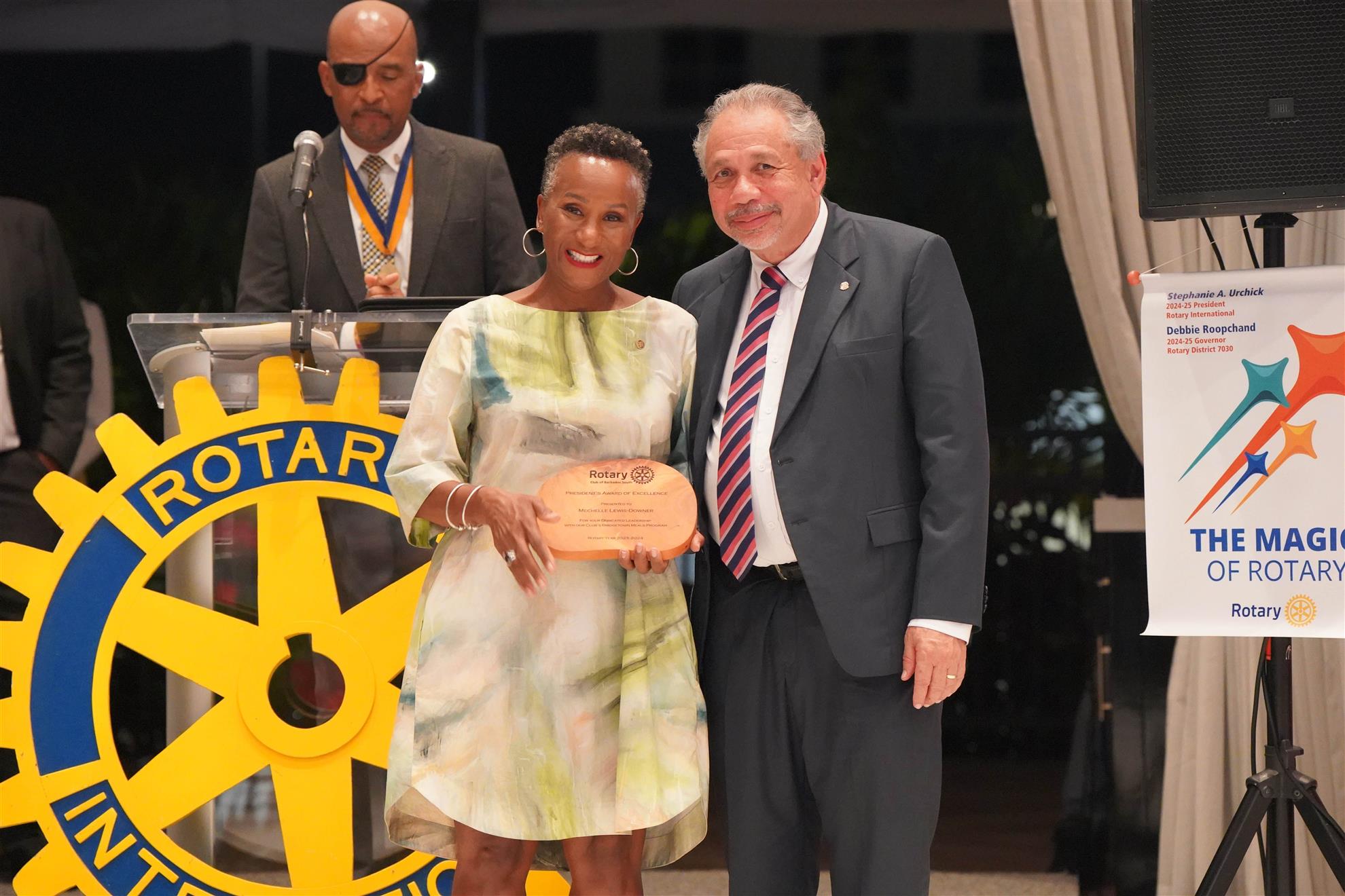 Dir Mechelle Lewis receiving her award from the chief justice