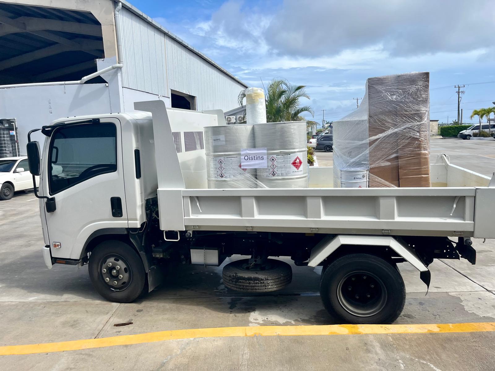 Truck carrying supplies for boat repair project