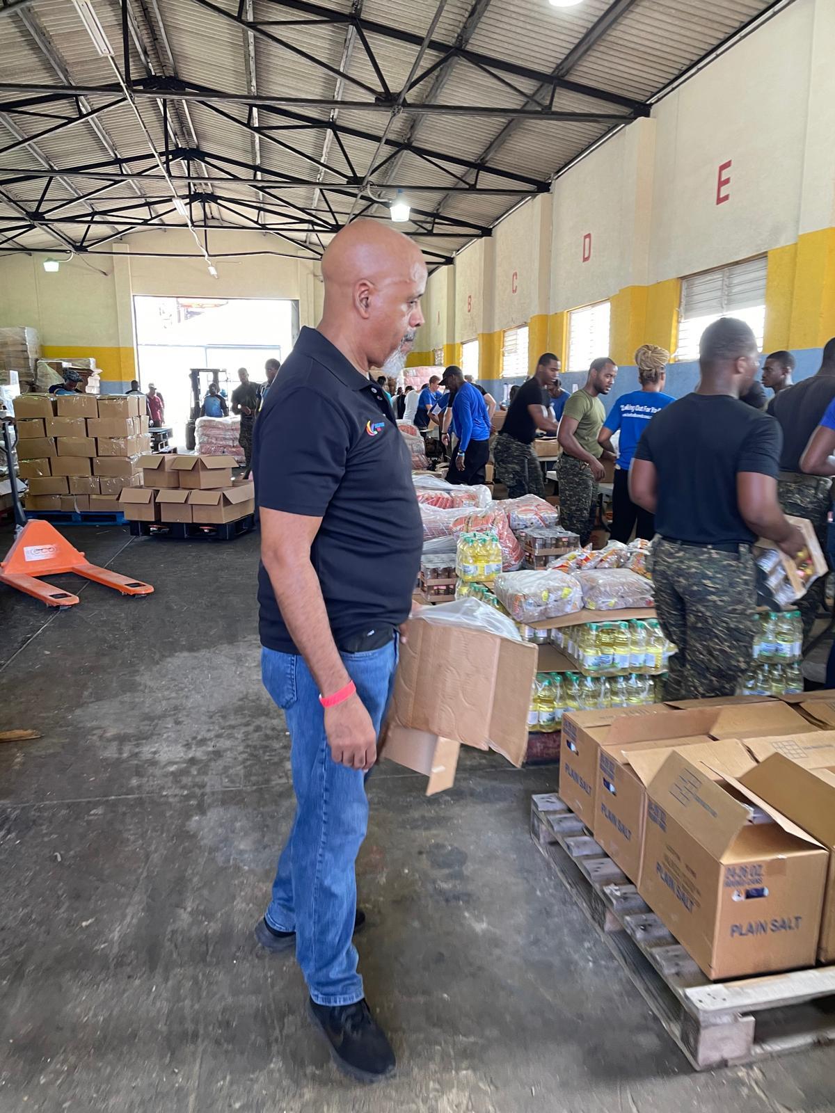 Rotarians hard at work packing boxes at the port to assist the victims of Hurricane Beryl