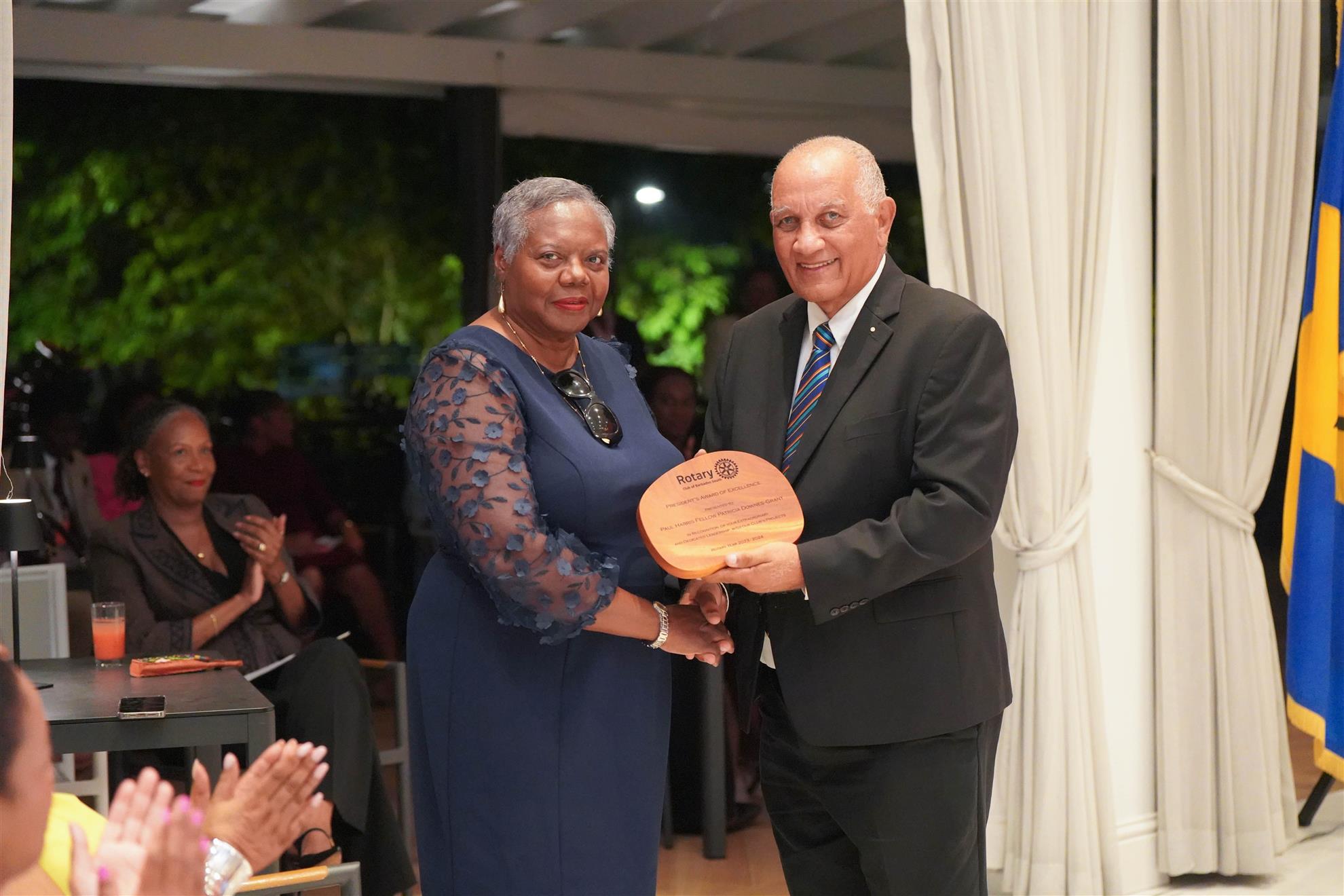 PHF Pat Downes-Grant receiving her award from PDG David
