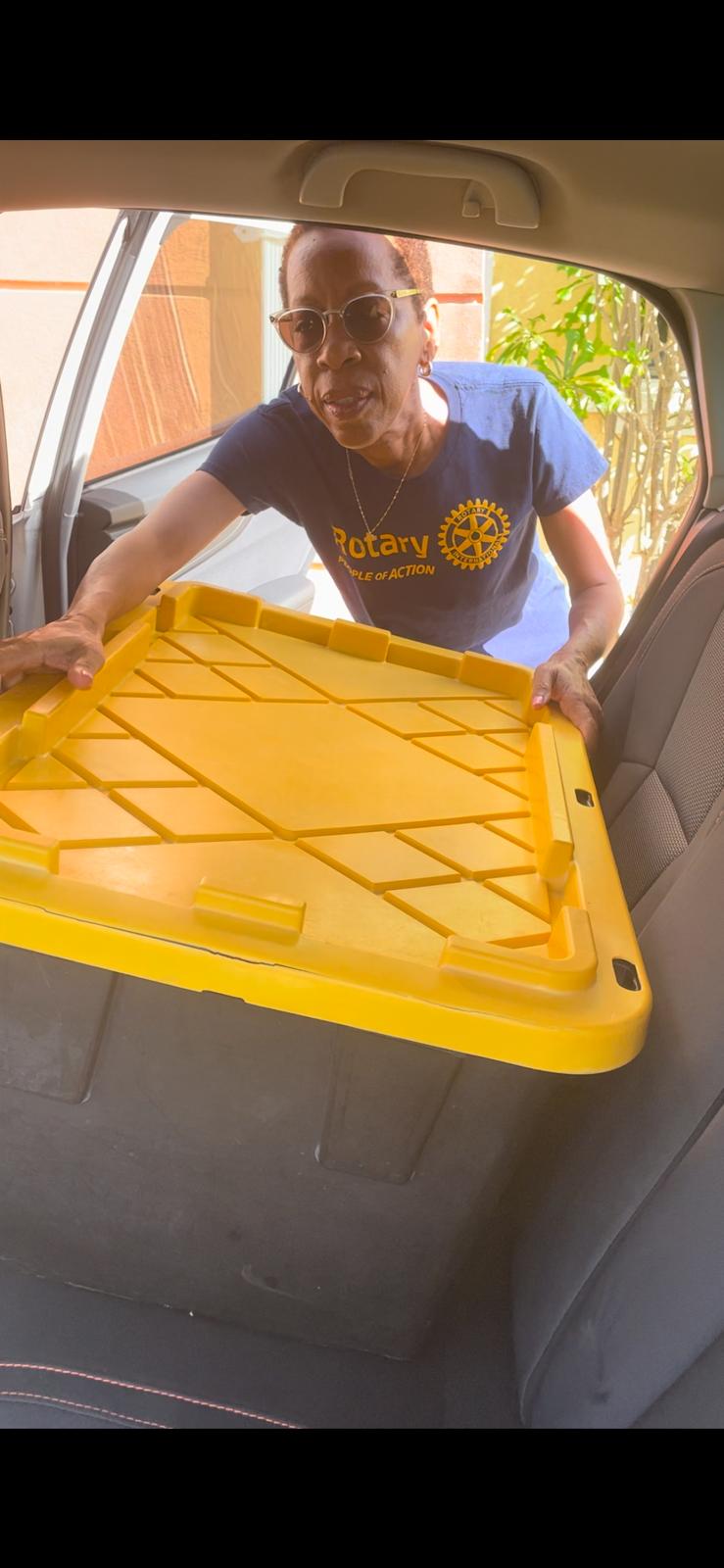President Terry loading meals into her car