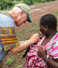 Steve Mecca giving polio vaccine in Ghana