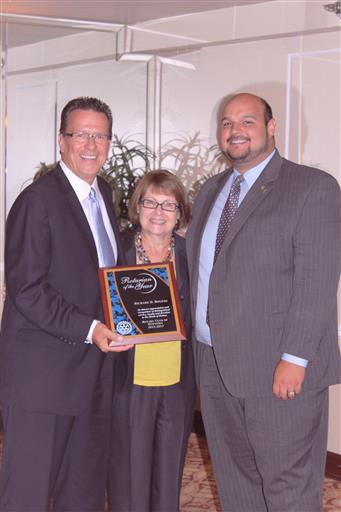 Rick Receives Award- Rick, Kathy, Jake