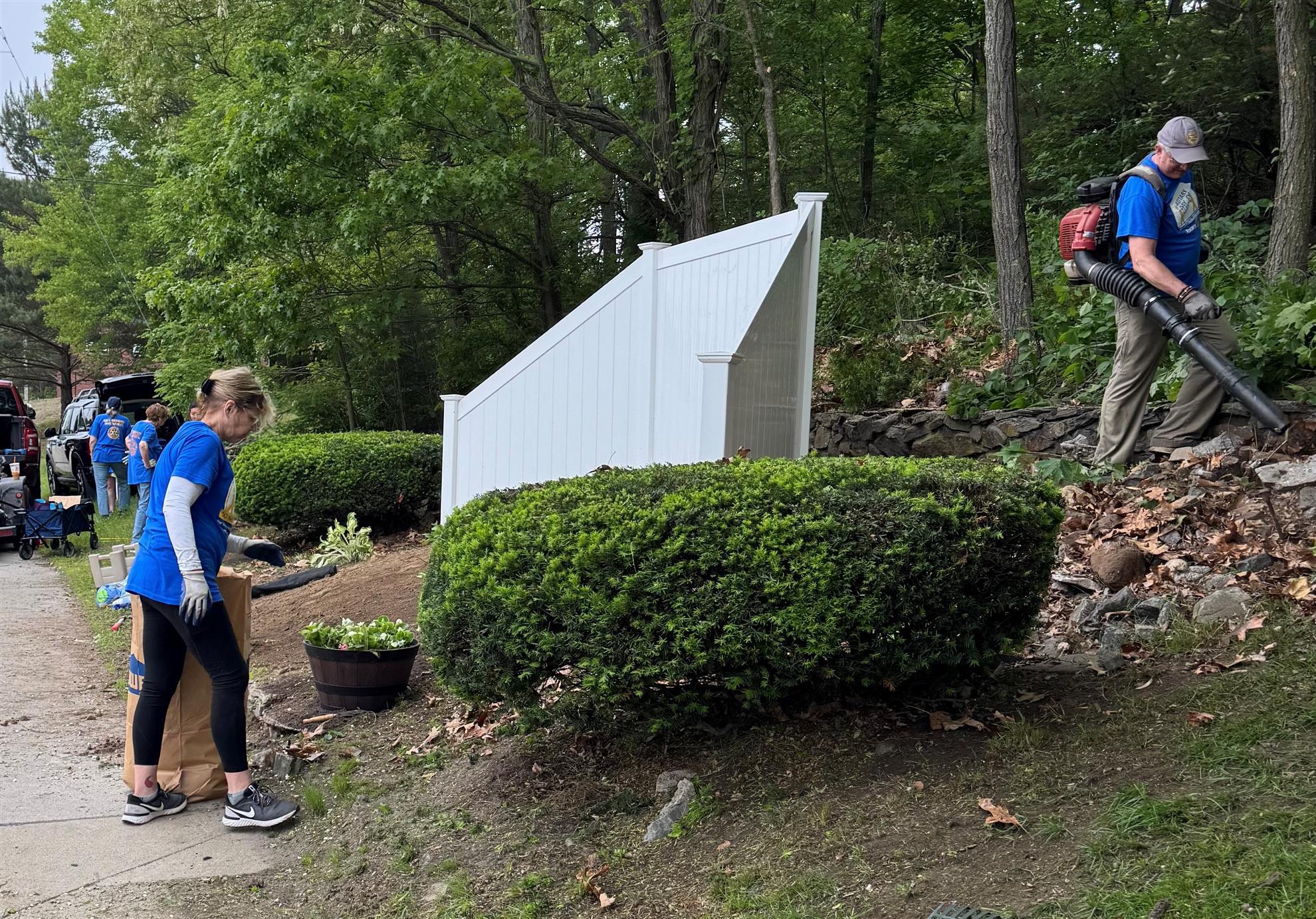 Rotarians at work Fence clean up Hamlet