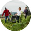 A group of people standing in the grassDescription automatically generated