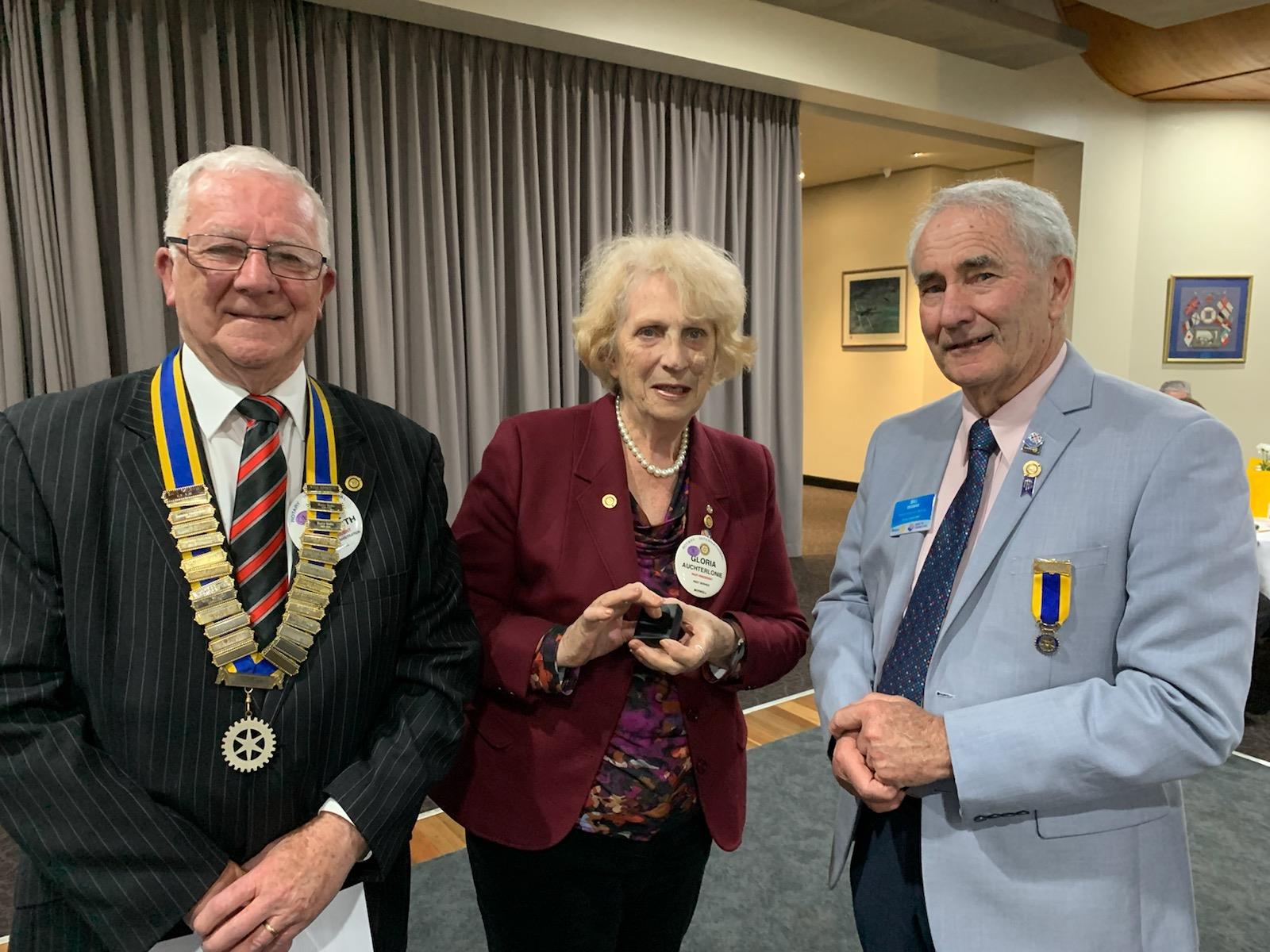 Gloria Auchterlonie receiving her Paul Harris Sapphire Pin