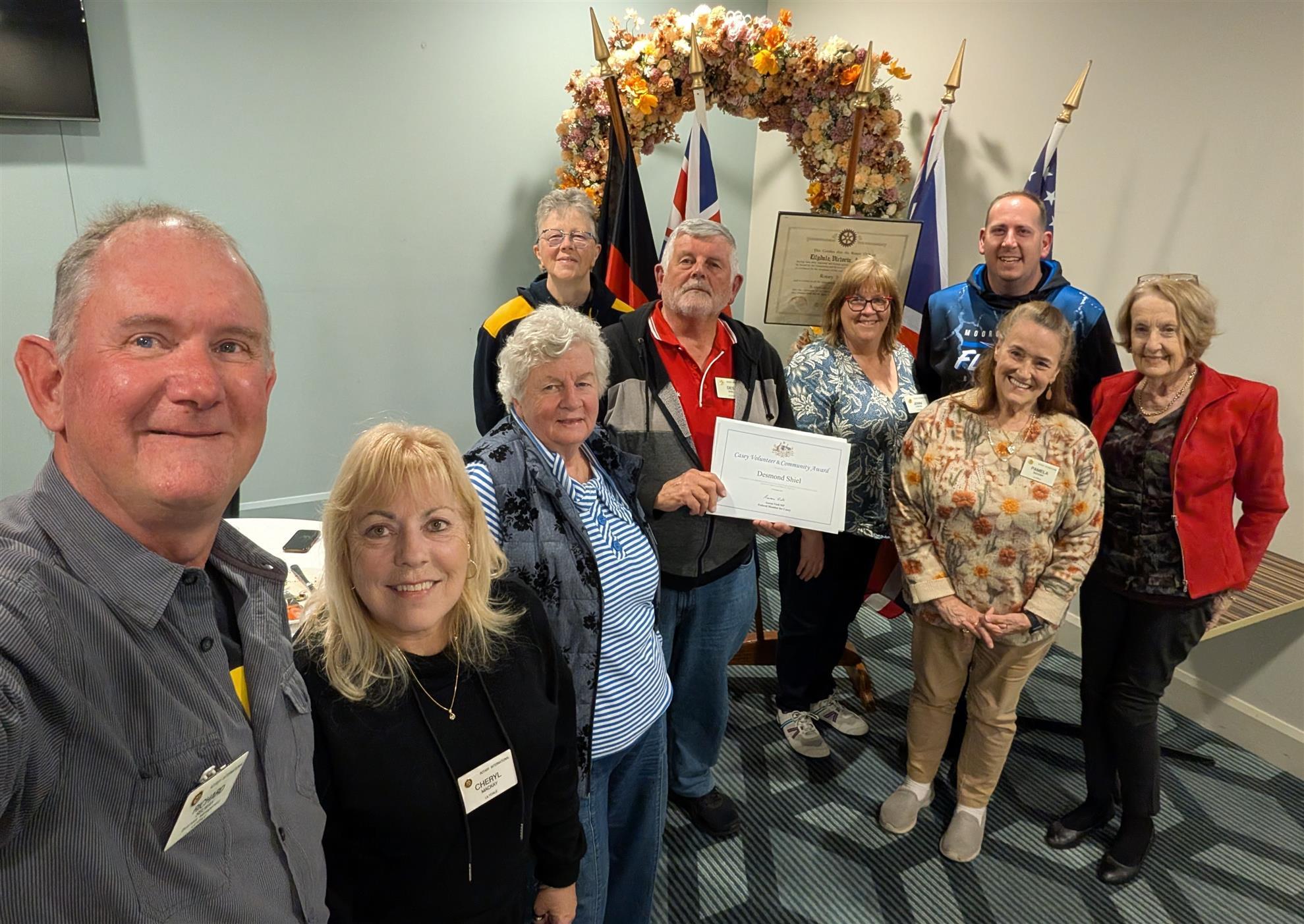 Some of the team celebrating Des's Community Award