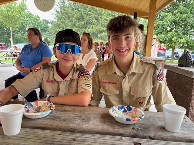 Boy Scout receiving an award at a picnic