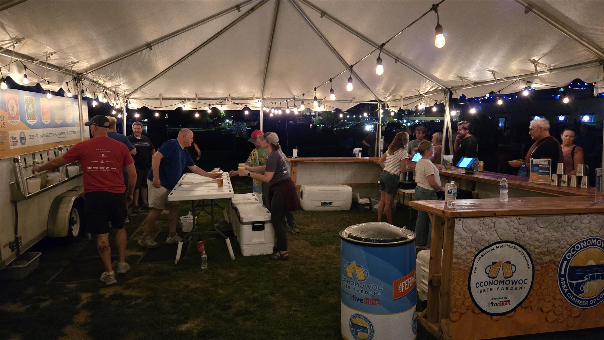 Rotarians serving drinks at Village Green