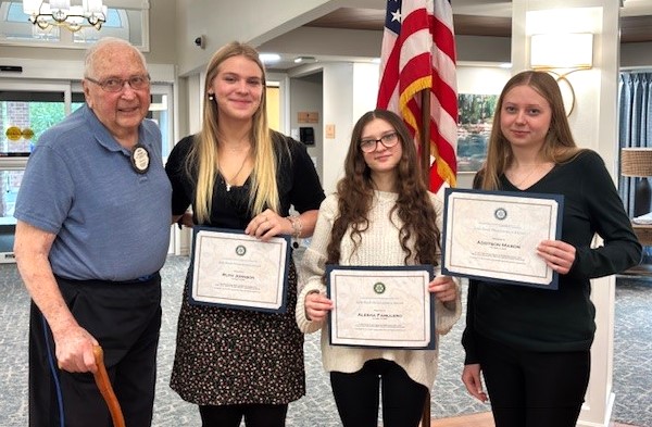 Award recipients pose for a photo with Award founder, Lyle Neeb.