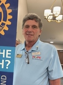 A person in a blue shirtAI-generated content may be incorrect.