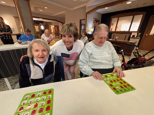 Pam helping them with their cards
