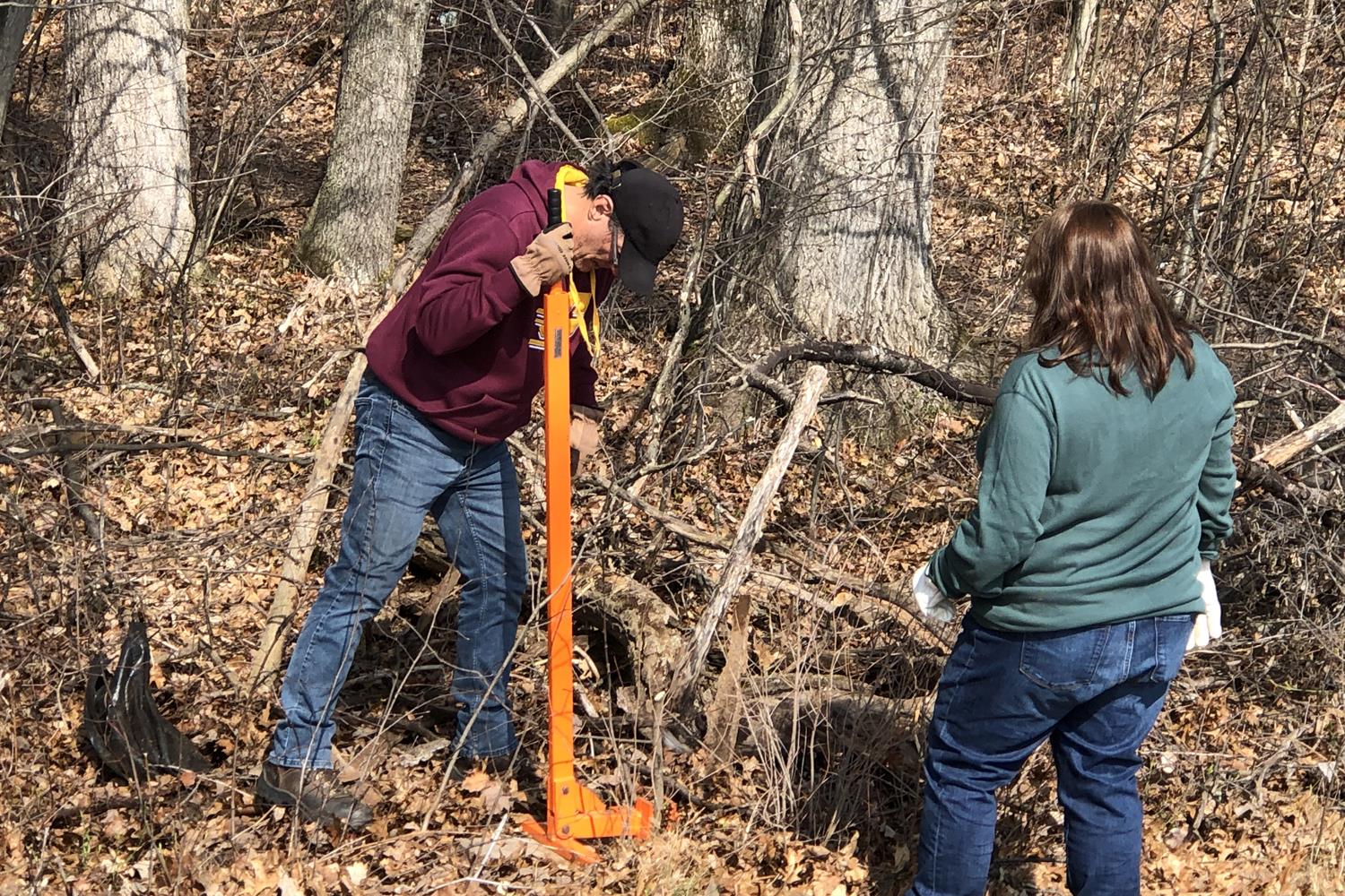 Rotarians and their families celebrated Earth Day 2022 by eradicating invasive plant species near the creek bed at West Midland Family Center.