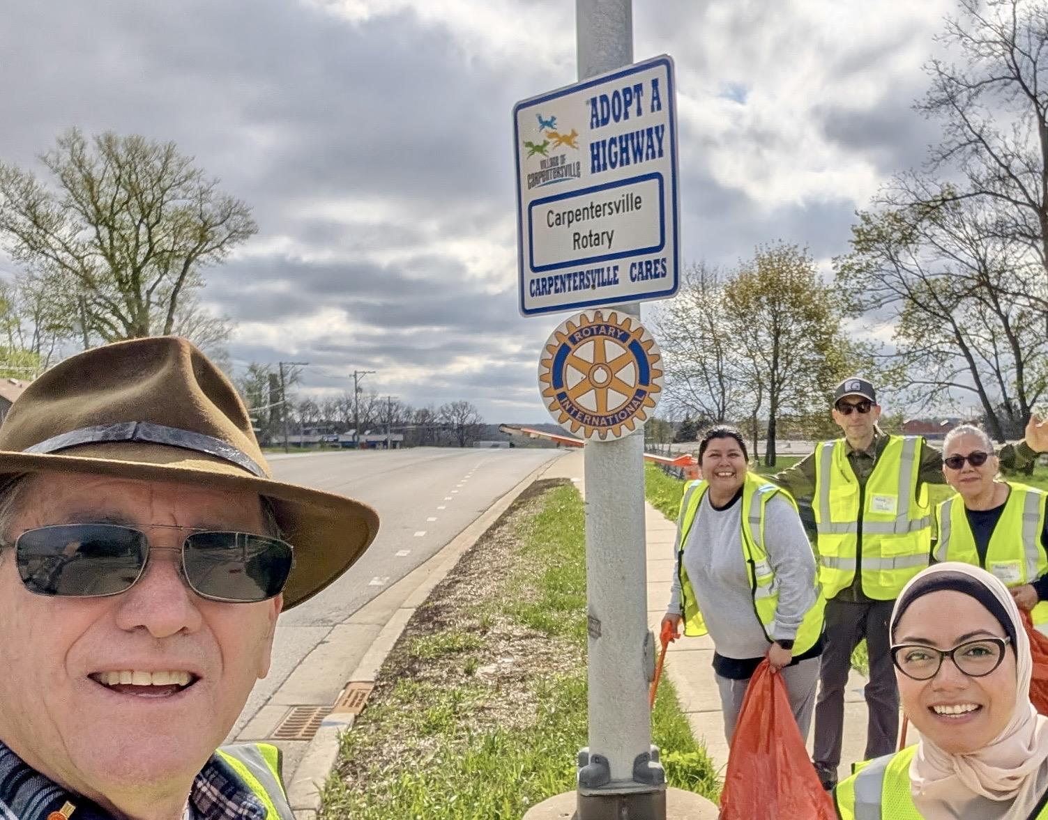 Rotary Club of Carpentersville members participating in a road cleanup