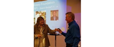 Bob receiving a Paul Harris pin for his financial contributions to The Rotary Foundation
