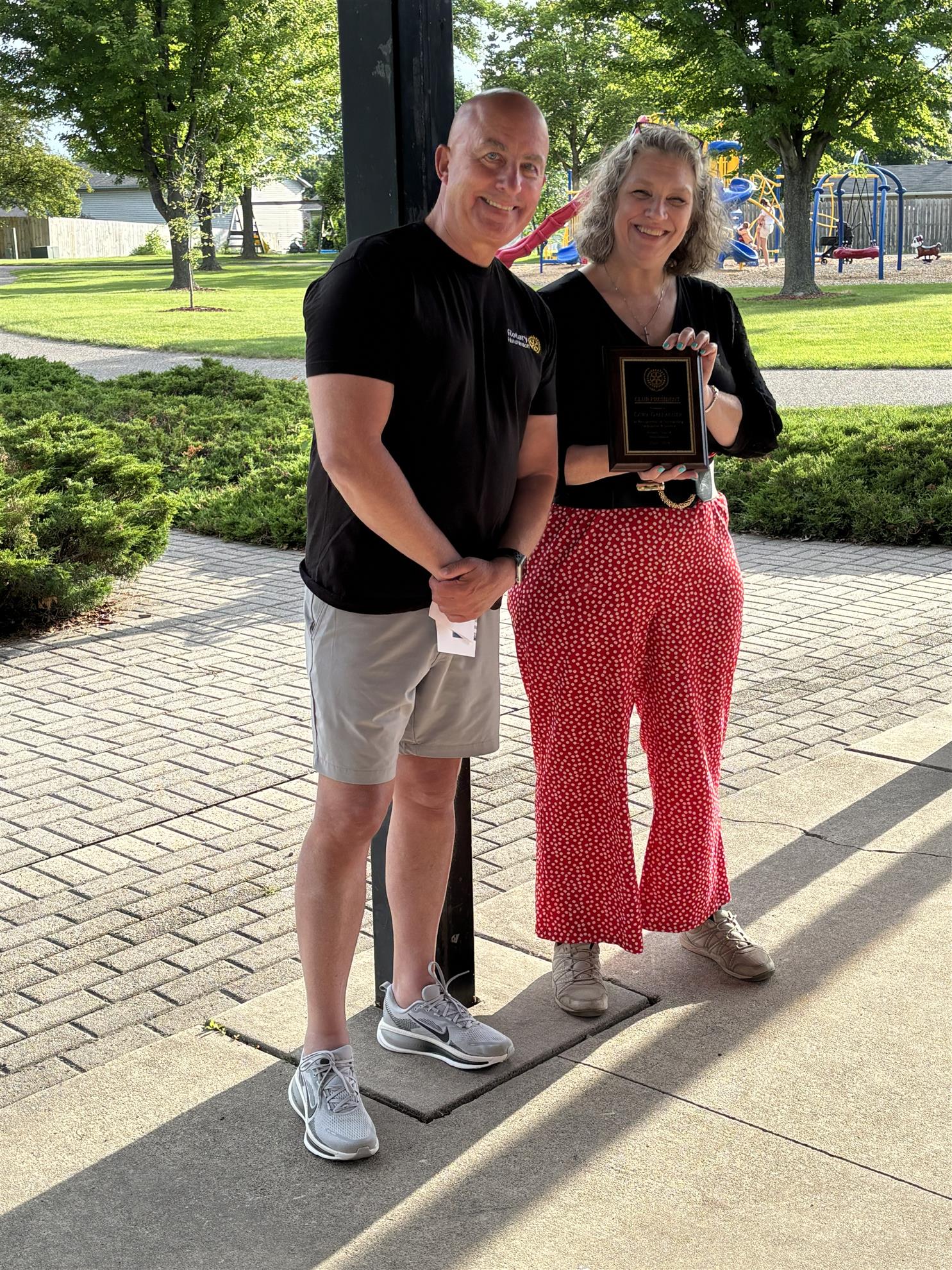 Incoming President, Lisa Hill, presented Cory with his year of service plaque for club president.