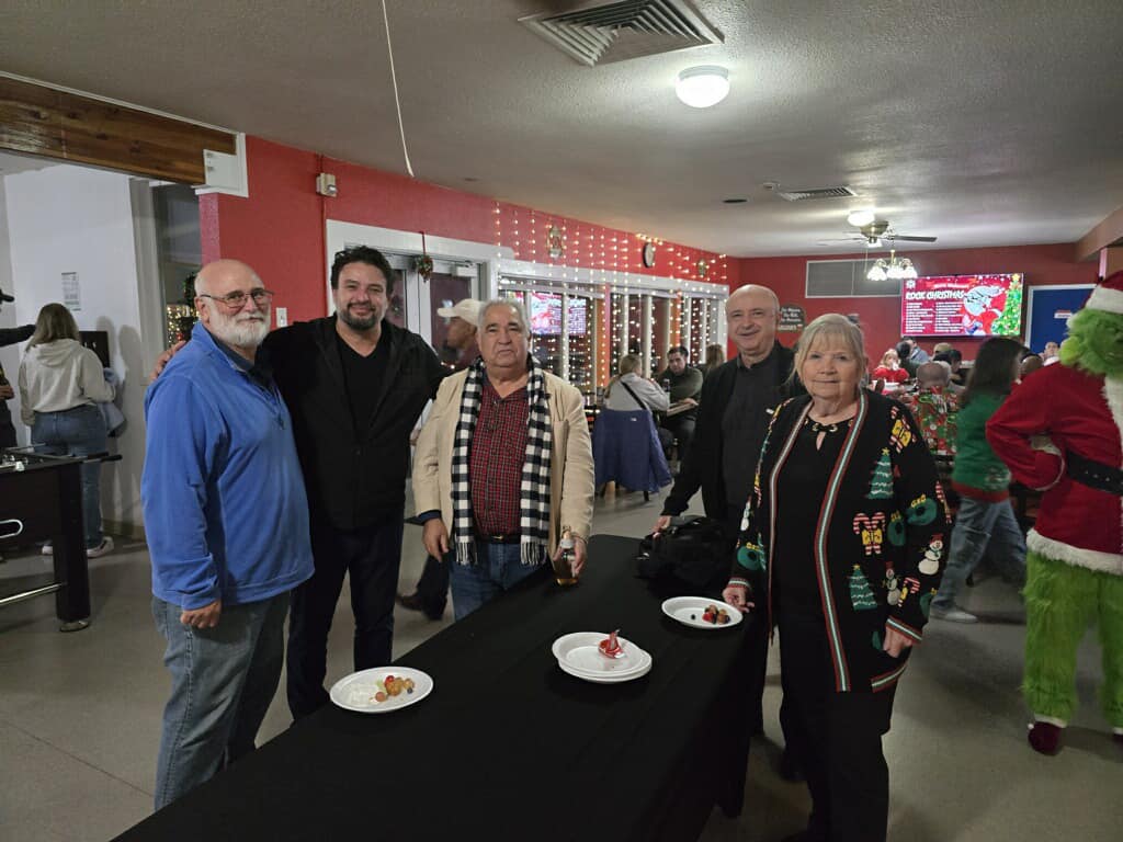 Rotarians gathered at Camp Parks to hand out gift cards to families. 