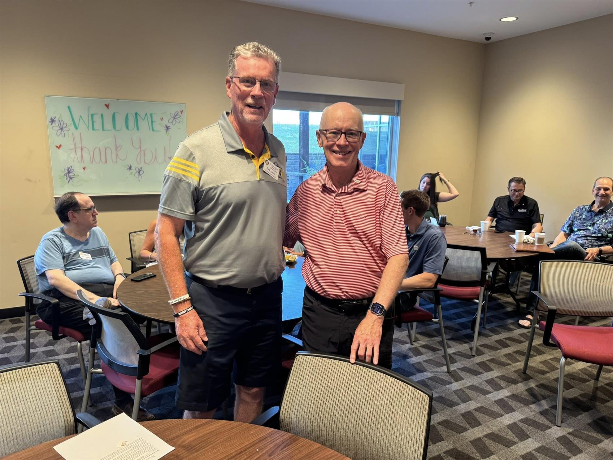 Jim Hyde & New Member Kevin Caine A picture of Jim Hyde and Kevin Caine following new member induction in our meeting room at Towneplace Suites. Jim is wearing black shorts and a grey golf polo and Kevin is in a red striped polo.