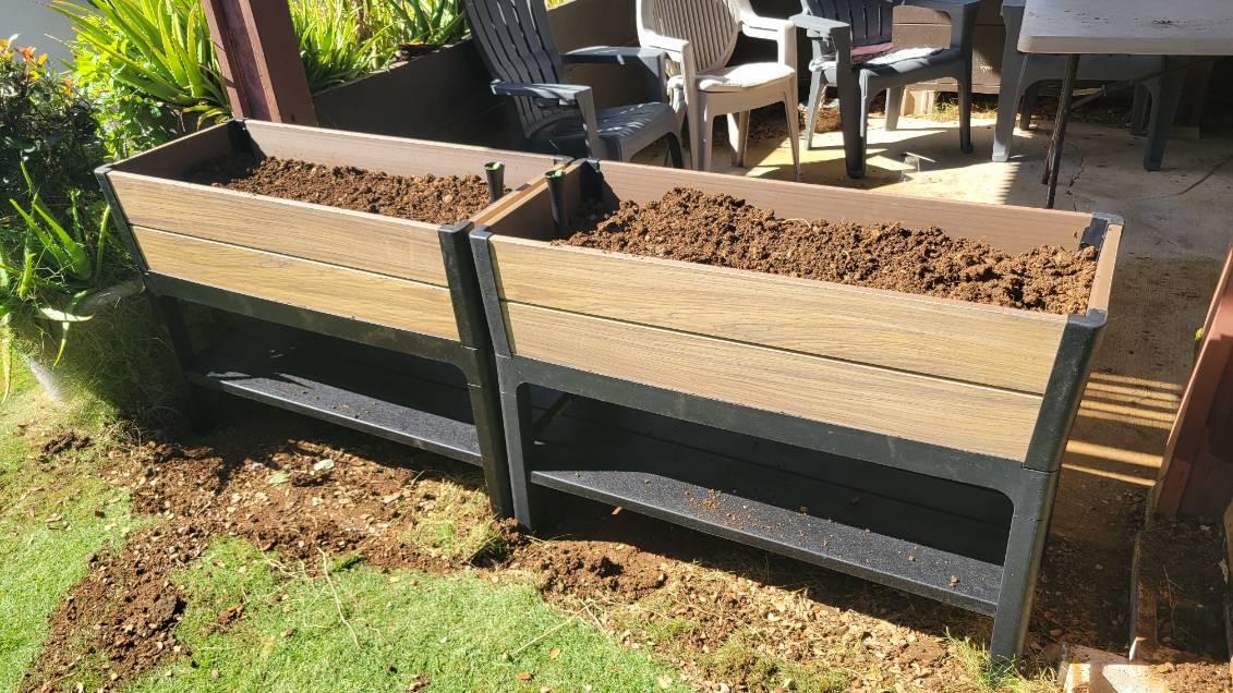 The finished planter boxes filled with soil