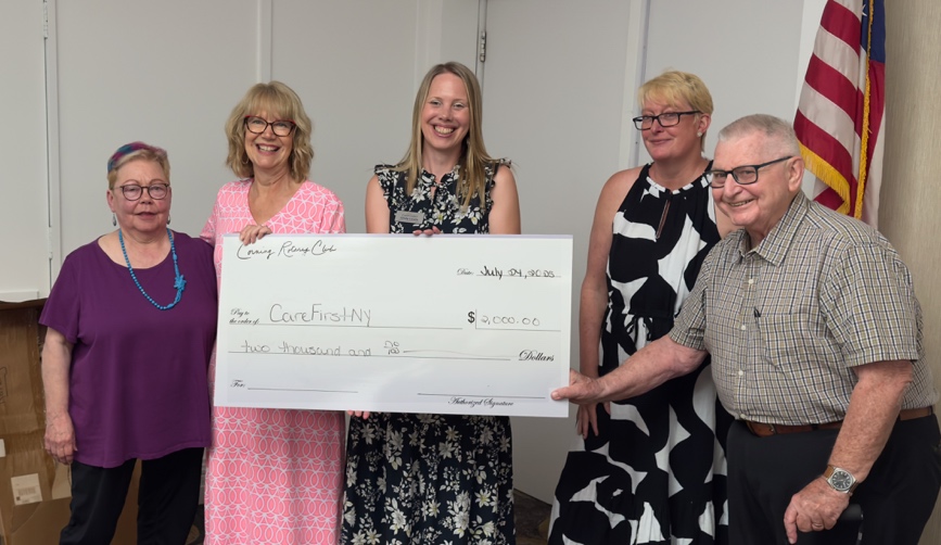 A group of people holding a large checkAI-generated content may be incorrect.