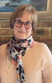 A person wearing glasses and a scarf

AI-generated content may be incorrect.